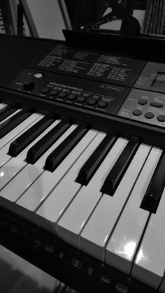 an electronic keyboard is shown in black and white