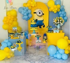 a birthday party with balloons and decorations for a despicable minion themed baby shower