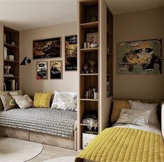 a bedroom with a bed, desk and bookshelf