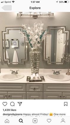 a bathroom with two sinks and mirrors on the wall next to it is decorated in silver