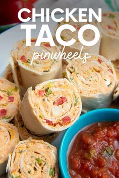 chicken taco pinwheels on a plate with salsa