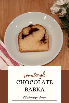 a white plate topped with a piece of chocolate babka next to a cup of coffee