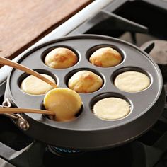 an image of some food being cooked in a pan on top of the gas stove