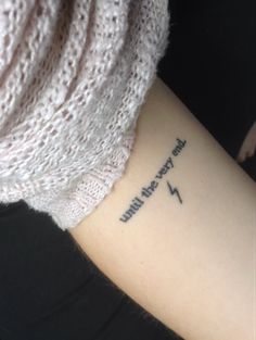 a woman with a tattoo on her arm that says, i will always be happy