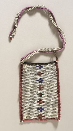 a cross body bag made out of beads