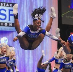 the cheerleaders are doing tricks for the crowd