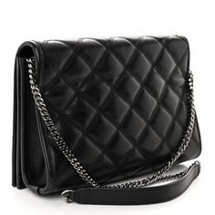 This is an authentic SAINT LAURENT Lambskin Quilted Mini Becky Chain Bag in Black. This elegant shoulder bag features chic quilted lambskin leather in black. The bag features a dark silver bijoux chain-link shoulder strap with black leather shoulder pads. The frontal flap features a prominent dark silver tone YSL monogram detail and opens to a black fabric interior with zipper and patch pockets. Chic Quilts, Saint Laurent Bag, Chain Bag, Wallet Chain, Chain Bags, Flap Bag, Lambskin Leather, Black Fabric, Shoulder Pads