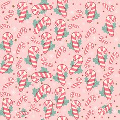 candy canes and holly on pink background