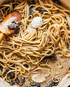 a pot filled with pasta and mushrooms