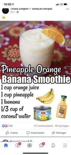 a banana smoothie with oranges and bananas on the side