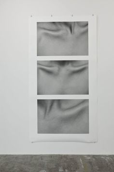 an abstract black and white photograph on a wall