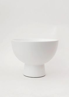 a white bowl sitting on top of a table