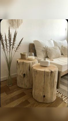 two wooden stools sitting next to each other on top of a hard wood floor