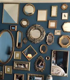 there are many different mirrors on the wall