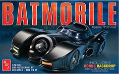 a batman movie poster with the batmobile