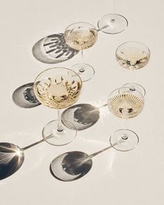 several wine glasses with different shapes and sizes