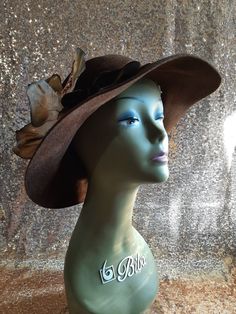 Check out this beautiful Vintage Betmar brown wool felt Floppy hat in excellent pre-loved condition, with a brown velvet ribbon bow and Lily cloth flower by side. very feminine elegant look. Size: 6.75" Dia. US and Canada orders $35 USD and above will deliver for free.  Thank you to watch my store. I sell vintage and handmade items and I try to describe them accurately, items are may be brand new, used and ages defected. You can evaluate the condition of the items in the photos but do not hesita Formal Brown Felt Hat With Short Brim, Adjustable Elegant Brown Felt Hat, Brown Brimmed Felt Hat For Formal Occasions, Brown Wool Felt Hat For Kentucky Derby, Elegant Brown Fedora For Kentucky Derby, Adjustable Brown Hats For Evening, Elegant Brown Wide Brim Felt Hat, Formal Brown Fedora Felt Hat, Brown Fedora Felt Hat For Formal Occasions