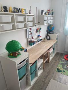 a child's playroom with toys and bookshelves