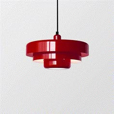 a red pendant light hanging from a ceiling