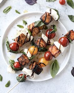 grilled chicken and cherry tomatoes on skewers with mozzarella sauce