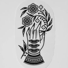 a black and white drawing of a hand with flowers on it