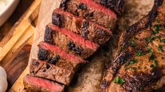 some meat is sitting on a cutting board