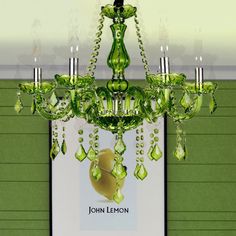 a green chandelier hanging from the ceiling in front of a sign that says john lemon