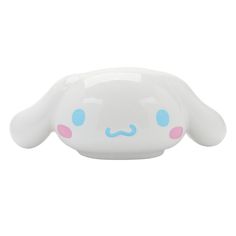 a white bunny shaped bowl with blue eyes and pink ears