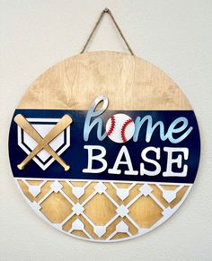 a home base sign hanging on the wall