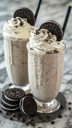 oreo cookies and milkshakes are served in glasses with chocolate chips on the side