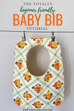 a baby bib hanging on the wall with text overlay that reads, the totally beginner friendly baby bib