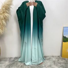 A stunning open abaya kimono dress to add to your collection. Available in 6 stunning gradient colors to be the statement piece you need for any outfit. Ombre Abaya, Color Abaya, Hijabi Casual Outfits, Burkha Designs, Ombre Butterfly, Abaya Styles, Abaya Outfit