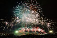 fireworks are lit up in the night sky