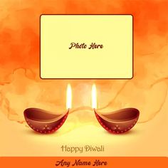 happy diwali greeting card with two lit candles on an orange and yellow background