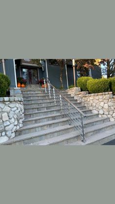 a man riding a skateboard down the side of a set of stairs