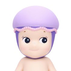 a toy doll with a purple hat on it's head and big blue eyes