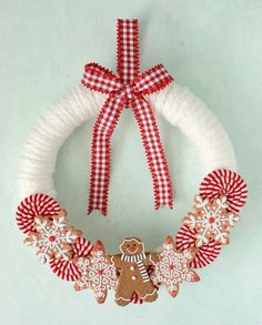 a christmas wreath with gingerbreads, snowflakes and candy canes on it