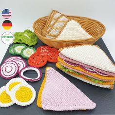 crocheted food items displayed on table with basket in background