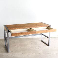 a wooden table with two drawers on it