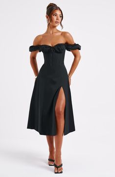 Must-have milkmaid midis are what we're wearing ALL season with sleek waves and mule heels. Courtney has dreamy puffed sleeves you can wear on or off the shoulders, with a snatched waist and pretty tie detail to the bust. The look is complete with a voluminous skirt and thigh high split. Colour: Black. Premium non stretch cotton. Underwired bust. Puffed sleeves. Waist cinching. Tie to bust. Voluminous skirt. Thigh high split. Midi length. Model is an XS and is wearing an XS. Sleek Waves, Skirt And Thigh Highs, Snatched Waist, Dresses Flowy, Mule Heels, Sparkle Dress, Dresses By Length, Formal Dresses Prom