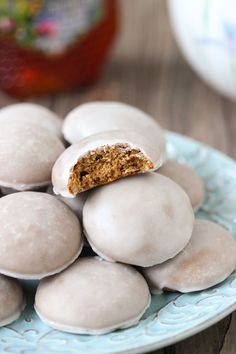 a plate full of white chocolate covered donuts