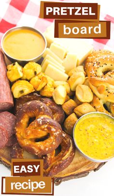 an assortment of pretzels, breads and other foods on a wooden platter