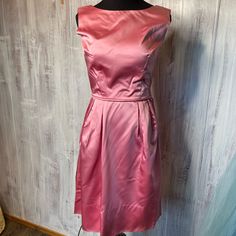 This Stunning Silk Ballgown Has A Pink Silk Fabric With A Flair At The Waist. Made Of A Structured Top With A Hidden Zipper On The Side, This Dress Is In Stunning Condition For Its Age! The Zipper Has A Small Section Of The Side That Needs To Be Repaired - The Price Reflects This. Mid-Shin Thigh, This Gown Is Perfect To Twirl Into Your Next Dance Or To Dress Up Like Your Man Is Coming Home From Ww2 ( Or Woman!) Measurements: 35” Bust 26” Waist 46” Hip ( Free ) 36” Long Pink Silk Fabric, Structured Top, Pink Silk Dress, Vintage Dresses 1960s, Pink Silk, Your Man, Coming Home, Silk Fabric, Vintage Pink