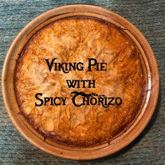 a pie with the words viking pie with spicy chorizo written on it in black