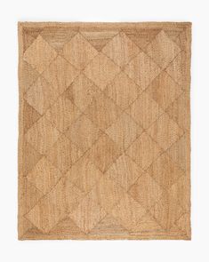 an area rug made out of jute and woven with diamond pattern on the side