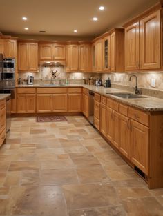 a large kitchen with wooden cabinets and granite counter tops