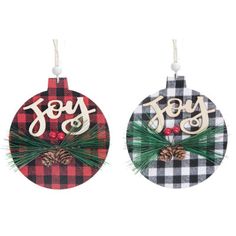 two christmas ornaments with the word joy on them and pine cones hanging from each ornament