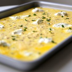 a pan filled with food sitting on top of a table