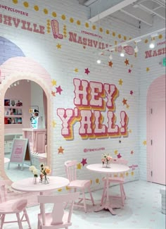 the interior of a children's playroom with pink furniture