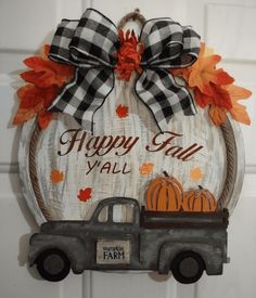 a sign that says happy fall y'all with an old truck and pumpkins